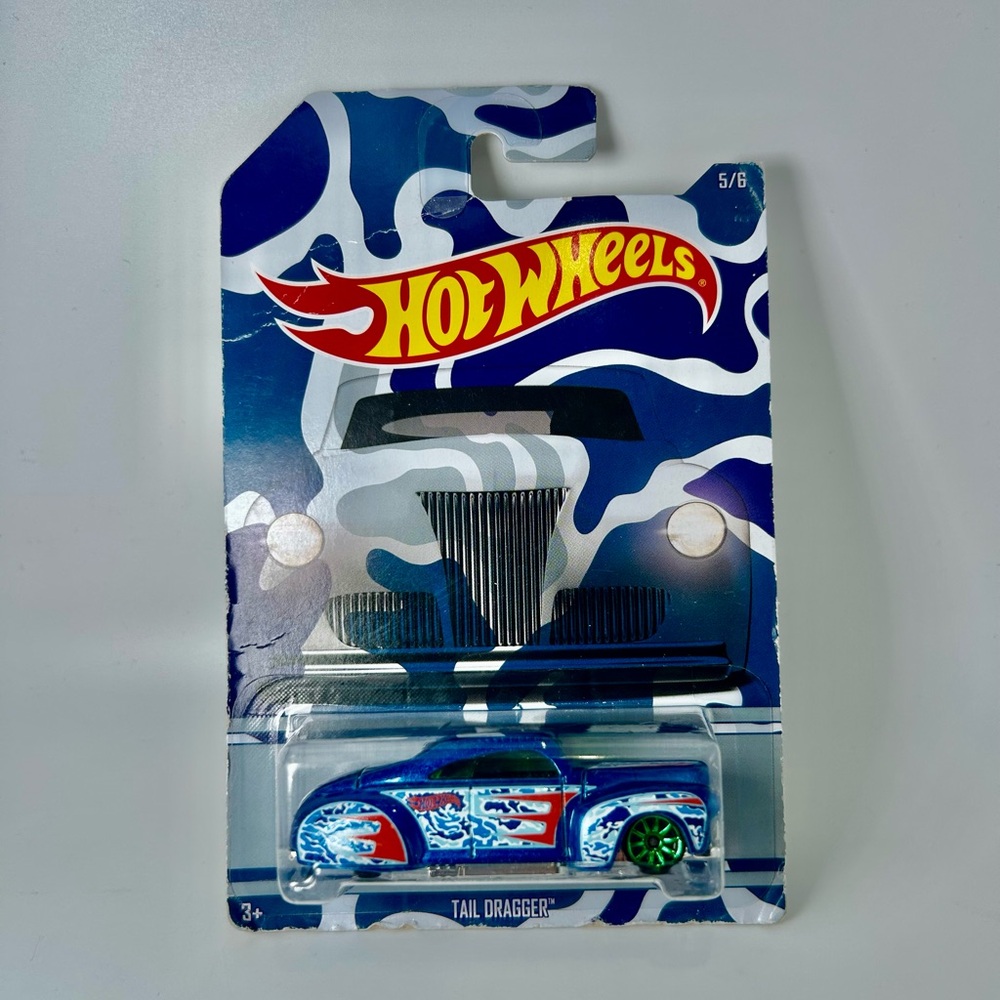 2015 Hot Wheels Camouflage Series 5/6 TAIL DRAGGER Blue w/Green 10 Spoke Wheels